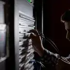 A man working with a server