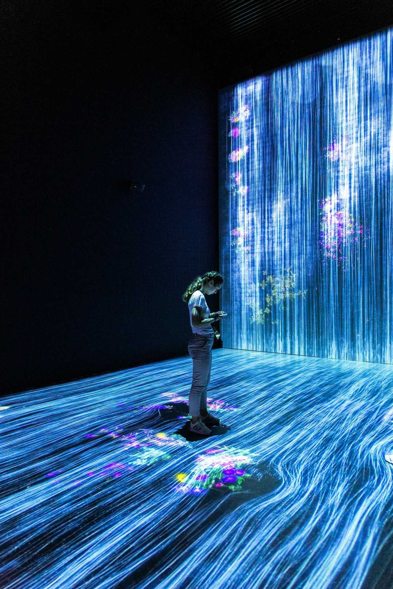 Woman in a room of screens