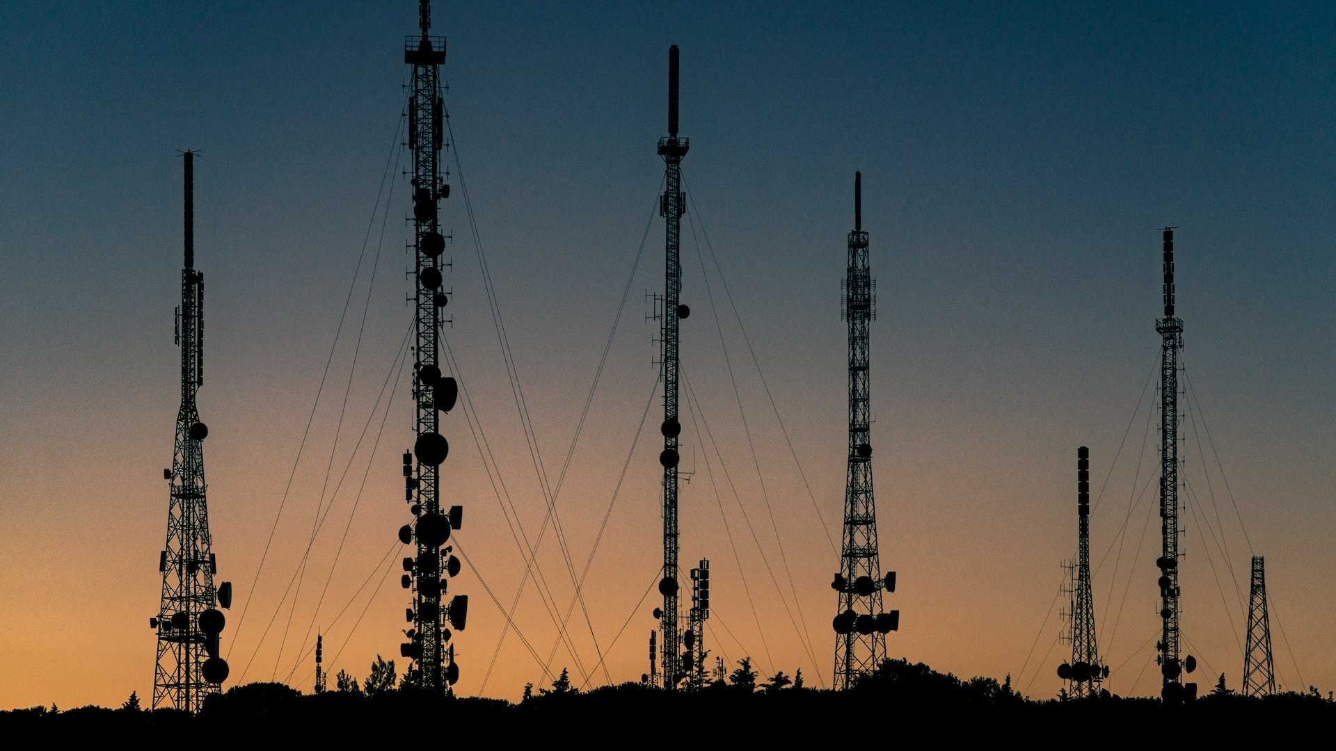 Telecom towers at sunrise